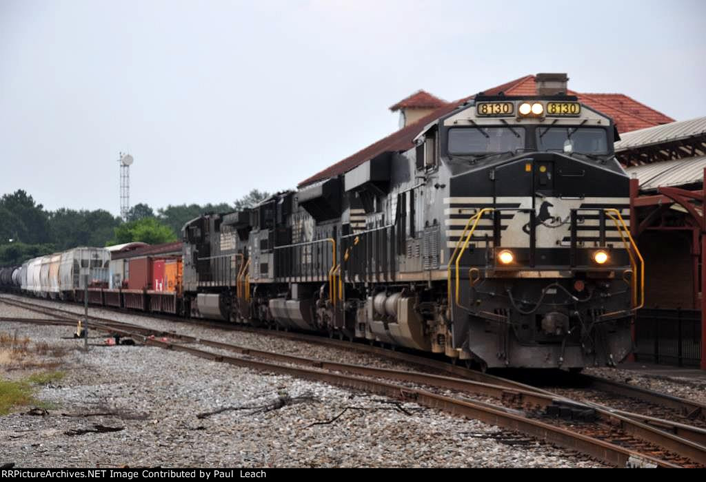 Manifest rolls west past the station